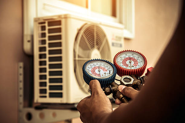 Professional Air Conditioning Service technician working in Clute, TX